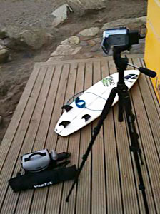 picture of video camera and surfboard