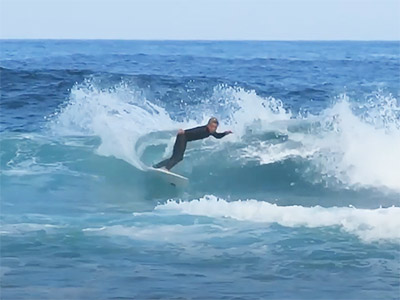 picture of Taylor carving a wave